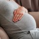 Pregnant woman on couch