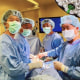 Huy Nguyen, second left, escaped Vietnam at age 12, and became a surgeon. Front right is his brother, Nang Nguyen, also a practicing surgeon. Nguyen’s two sons are left – Eric Nguyen, a family medicine resident, and second right, Brandon Nguyen, a surgical resident.