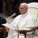 Pope Leo XIV  speaks to reporters.