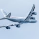 A plane flies in the sky