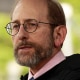 Alan Garber speaks into a microphone.