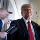 President Donald Trump listens to questions 