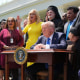 President Donald Trump, joined by lawmakers and religious leaders, prepares to sign an executive order establishing the Commission on Religious Liberty during a National Day of Prayer event in the Rose Garden at the White House on May 1, 2025.