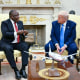 Cyril Ramaphosa gestures while he speaks with Donald Trump.