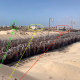 NBC News verified footage from an aid distribution site in Rafah by comparing landmarks in the background of the video, highlighted in the circles above, to recent satellite imagery and drone video released by the IDF.