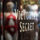 Text that reads "Victoria's Secret" on a window in front of a store