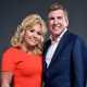 Julie and Todd Chrisley  pose for a portrait.