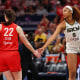 Angel Reese #5 of the Chicago Sky and Caitlin Clark #22 of the Indiana Fever meet at mid court prior to tipoff for the Fever's home opener at Gainbridge Fieldhouse on Saturday in Indianapolis, Indiana.