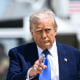 US President Donald Trump gestures as he walks to board Air Force One at Joint Base Andrews in Maryland on May 12, 2025.