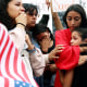 Family members cry during a protest