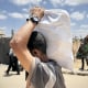 Palestinians flock to the aid distribution point in Gaza for the second day in a row