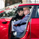 Elon Musk and President Donald Trump inside of a Tesla model S vehicle parked outside of the White House
