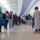 Travelers wait to go through security at San Francisco International Airport on May 23, 2025.