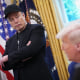 Elon Musk listens as President Donald Trump speaks in the Oval Office on May 30.