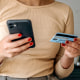 Young casually clothed woman online shopping.