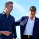Gavin Newsom, left, and Donald Trump walk outside
