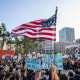 Image: immigration protest american usa flag demonstration