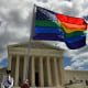 A supporter of same-sex marriage waves his rainbow flag 