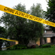 Police tape blocks off a home