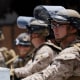 Protesters demonstrate in front of U.S. Marines guarding a federal building on June 14, 2025 in Los Angeles.