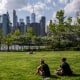 People sit in Brooklyn Bridge park