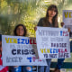 People with signs.