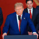 President Donald Trump speaks at a lectern at the White House