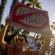 A person holds a sign in a protest.