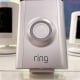 Ring security cameras are displayed on a shelf