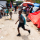 Image: A child leaves for school from a displaced persons camp