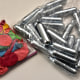 Balloons and nitrous oxide bottles are seen displayed on a table.