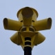 A triptych showing siren at the Comfort Volunteer Fire Department headquarters and siren installed in a park near Cypress Creek.