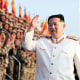 North Korean leader Kim Jong Un acknowledges the officers and soldiers who took part in a celebration the 90th founding anniversary of the Korean People's Revolutionary Army, in North Korea Wednesday, April 27, 2022.