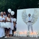 Jabari Peoples family members hold balloons