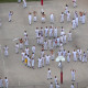 Migrant detainees react as a helicopter passes overhead at Krome Detention Center on July 4, 2025 in Miami, Fla.