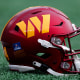 A Washington Commanders helmet on the field