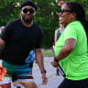 A mother and son at a line dance class in Boston's Franklin Park on July 16, 2025. The Boston Rhythm Riders host classes to boost the visibility of line dancing and its cultural significance.