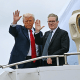 President Donald Trump and Britain's Prime Minister Keir Starmer wave as they board Air Force One in Glasgow, Scotland on July 28, 2025. 