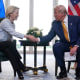 President Donald Trump and European Commission President Ursula von der Leyen shake hands.