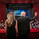 President Donald Trump and first lady Melania Trump wave from balcony at the John F. Kennedy Center for the Performing Arts