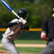 View of baseball batter from behind the catcher as they hit