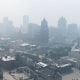 Aerial view of a blanket of smoke filling the air above buildings