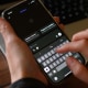A person uses ChatGPT on their phone.