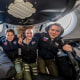 From left, NASA’s SpaceX Crew-10 members JAXA astronaut Takuya Onishi, NASA astronauts Anne McClain and Nichole Ayers, and Roscosmos cosmonaut Kirill Peskov pose for a portrait inside the SpaceX Dragon spacecraft that will return them back to Earth.