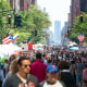 Street Fair was opened on the Lexington Avenue at Midtown Manhattan New York on Jul. 30 2017. Crowd walks down the Lexington Avenue among the many street shops along the tree lined street. Rows of Midtown buildings can be seen behind.