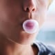 A child chews gum.