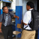 Schools enforce order and discipline" regulations in San Salvador