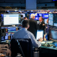 Traders work on the floor at the New York Stock Exchange