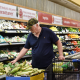 A man shops at supermarket.