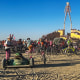Attendees gather on the Playa at the Burning Man Festival in 2024.